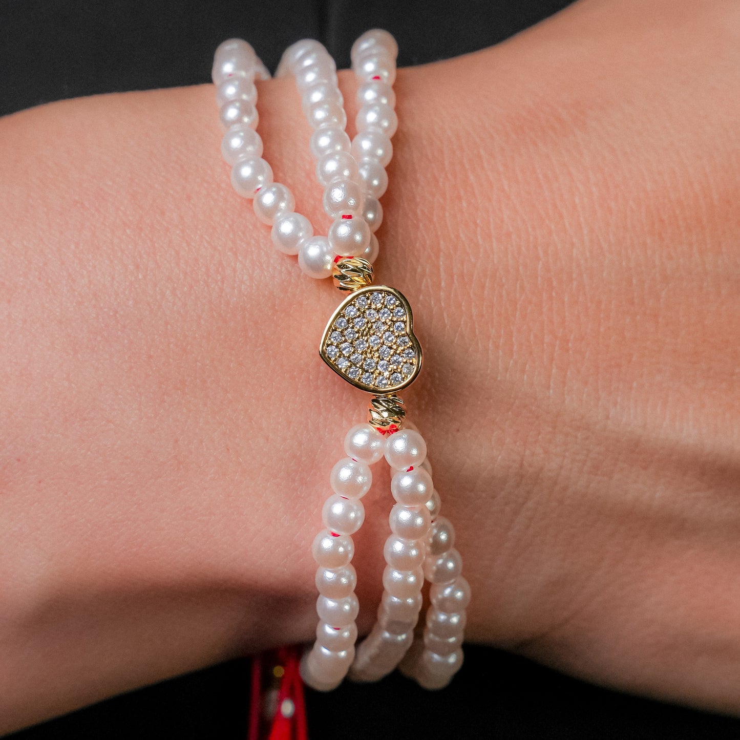 Pulsera en perla con dije de corazón