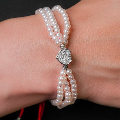 Pulsera en perla con dije de corazón