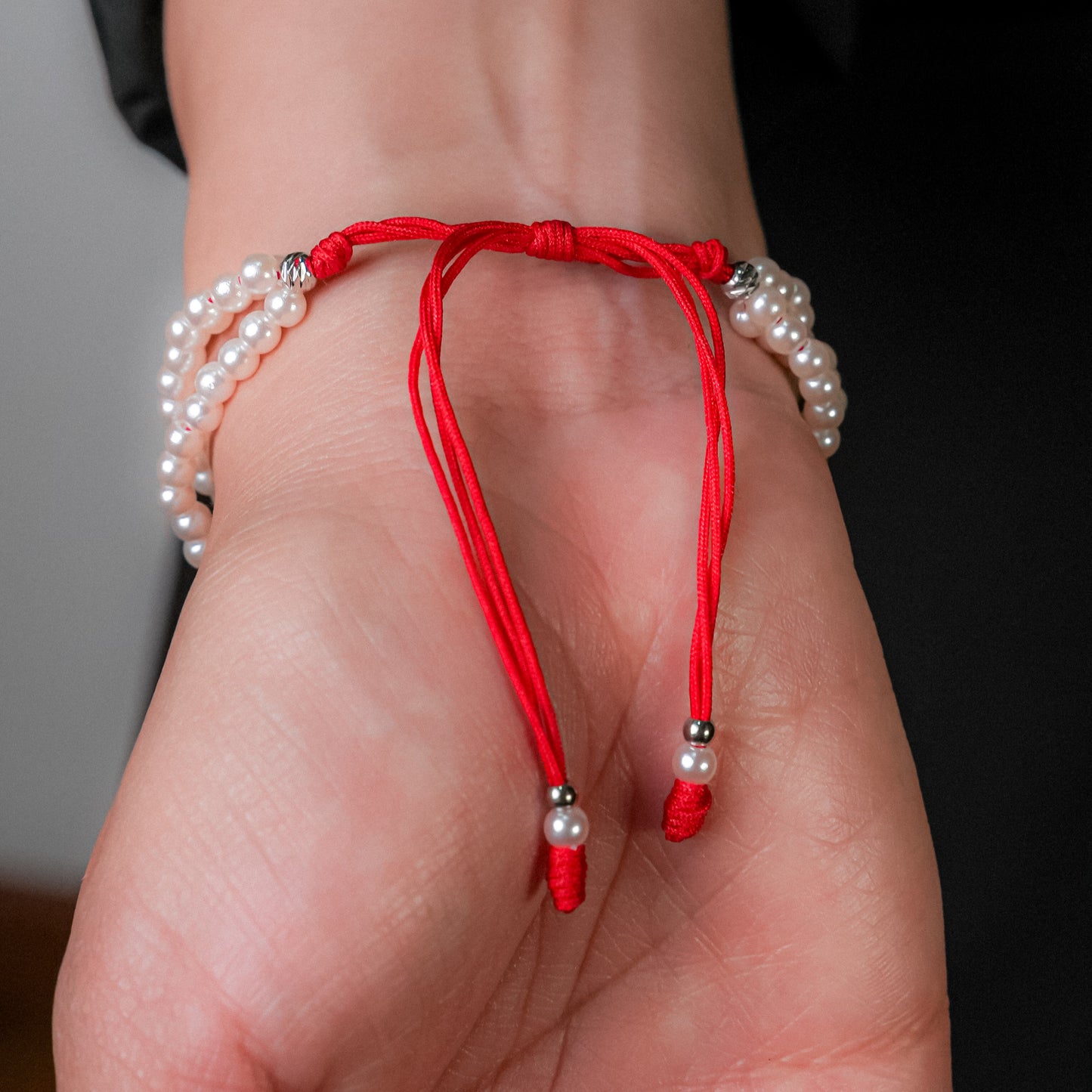 Pulsera en perla con dije de corazón